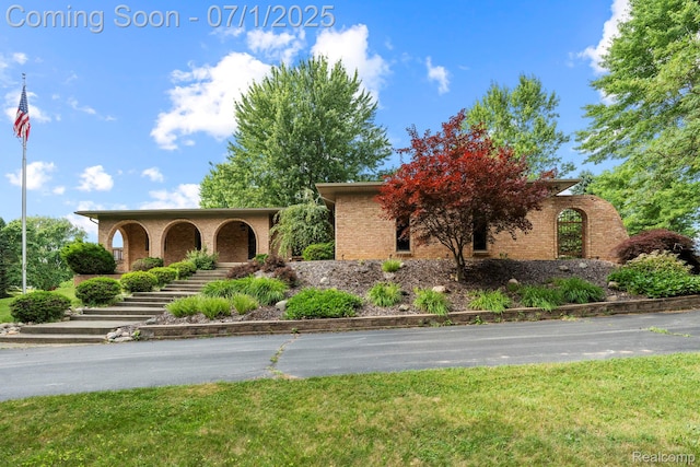 945 E Gunn Rd, Rochester, MI 48306 - view of front of house featuring brick siding and stairway