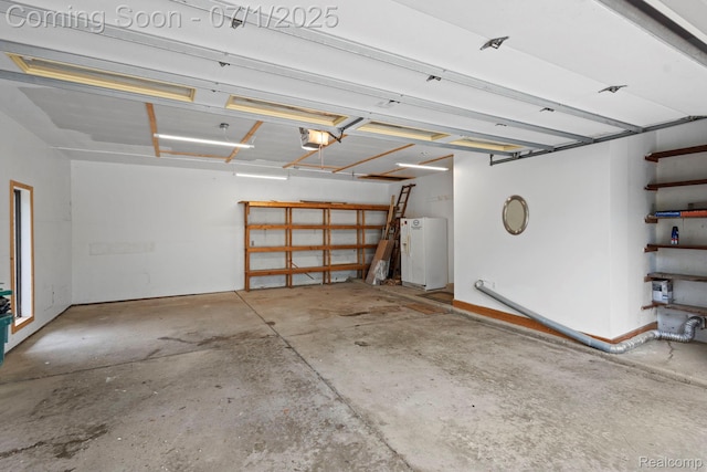 945 E Gunn Rd, Rochester, MI 48306 - garage with white refrigerator with ice dispenser and a garage door opener