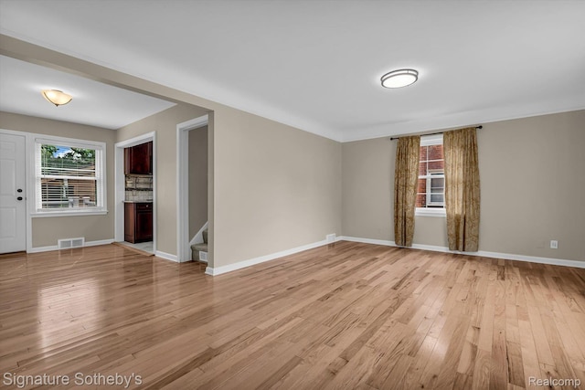 1717 Penistone St, Birmingham, MI 48009 - spare room with light wood-style floors and stairs