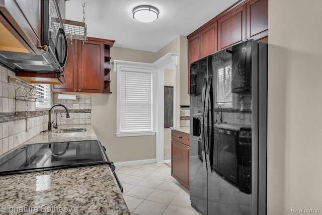 1717 Penistone St, Birmingham, MI 48009 - kitchen with black appliances, backsplash, light stone counters, and open shelves