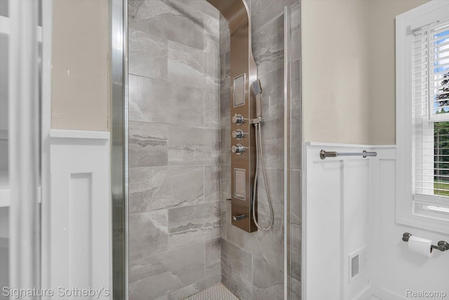 1717 Penistone St, Birmingham, MI 48009 - bathroom featuring a shower stall and a wainscoted wall