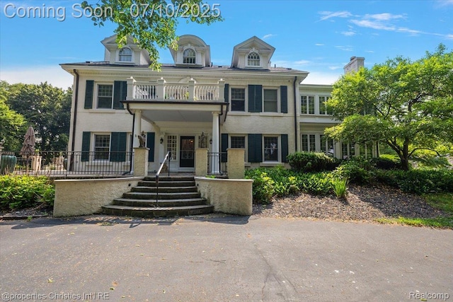 777 Kensington Ln, Bloomfield Hills, MI 48304 - view of front facade with a balcony and a porch