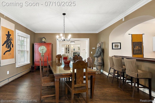 777 Kensington Ln, Bloomfield Hills, MI 48304 - dining room featuring arched walkways, a chandelier, wood finished floors, ornamental molding, and a baseboard radiator