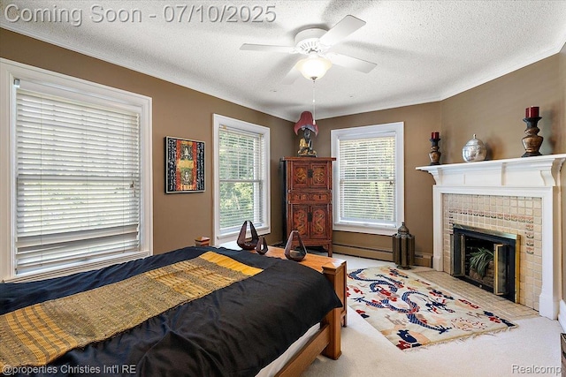 777 Kensington Ln, Bloomfield Hills, MI 48304 - bedroom with a textured ceiling, a tile fireplace, carpet, a ceiling fan, and a baseboard radiator