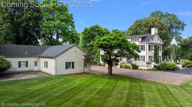 777 Kensington Ln, Bloomfield Hills, MI 48304 - rear view of house featuring a yard and a patio