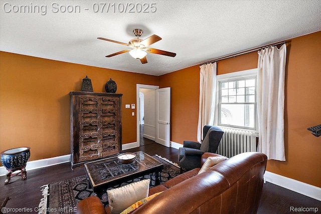 777 Kensington Ln, Bloomfield Hills, MI 48304 - living area featuring a ceiling fan, wood finished floors, a textured ceiling, and radiator heating unit