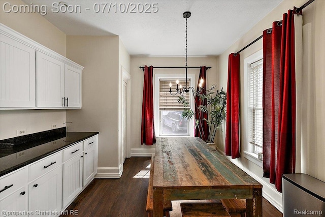 777 Kensington Ln, Bloomfield Hills, MI 48304 - dining area with a chandelier and dark wood finished floors