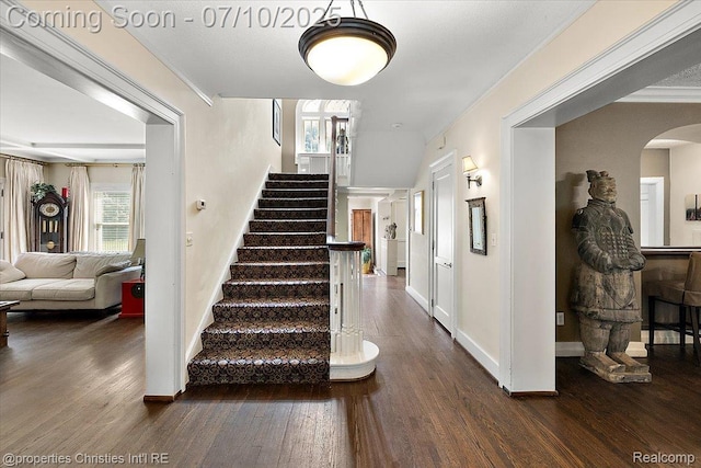 777 Kensington Ln, Bloomfield Hills, MI 48304 - staircase featuring wood finished floors, arched walkways, and crown molding