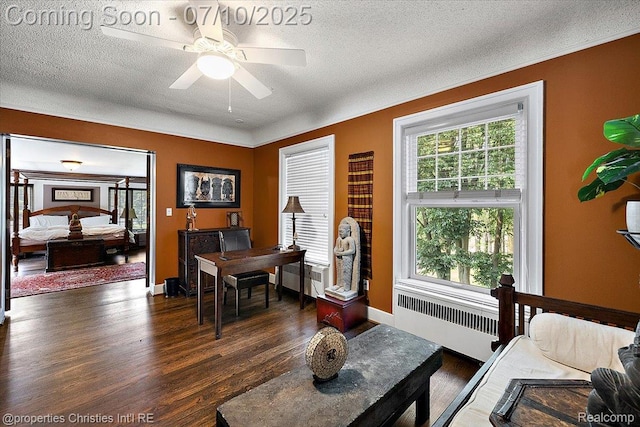 777 Kensington Ln, Bloomfield Hills, MI 48304 - office area with radiator heating unit, dark wood-style flooring, a ceiling fan, and a textured ceiling