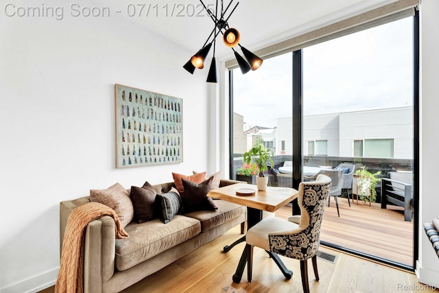 258 Edmund Pl, Detroit, MI 48201 - dining space with healthy amount of natural light, wood finished floors, and expansive windows