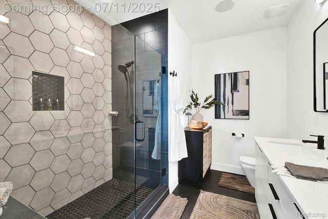 258 Edmund Pl, Detroit, MI 48201 - bathroom with a shower stall, vanity, and wood finished floors
