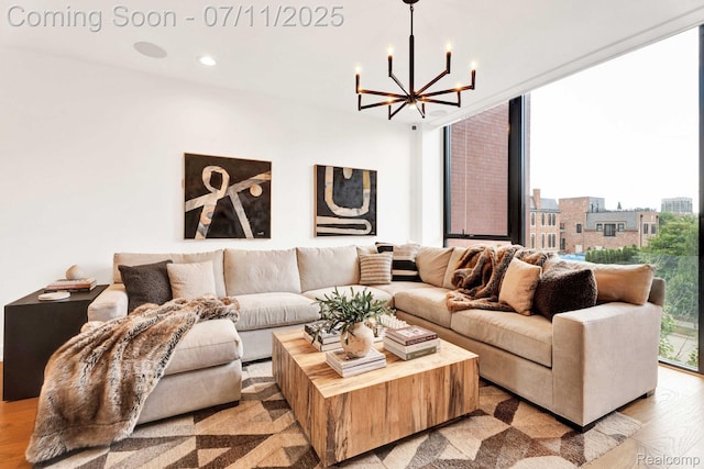 258 Edmund Pl, Detroit, MI 48201 - living room featuring a chandelier, light wood-style flooring, recessed lighting, and floor to ceiling windows