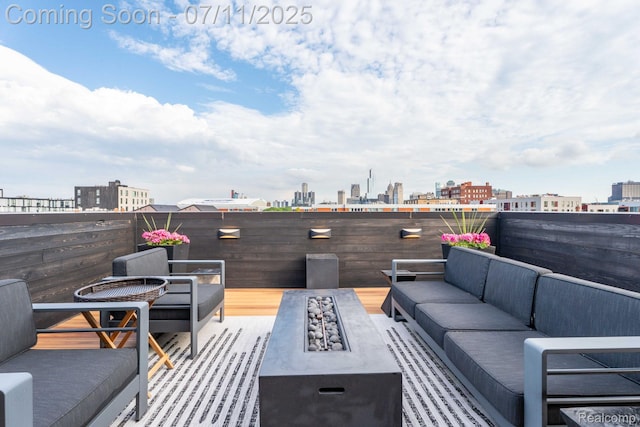 258 Edmund Pl, Detroit, MI 48201 - view of patio / terrace with an outdoor living space with a fire pit and a skyline view