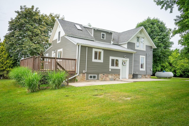 2620 N 184th Ave, Walkerville, MI 49459 - view of front of property featuring a wooden deck, a patio, a front yard, and a metal roof