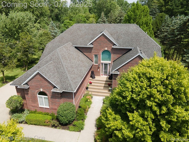 6120 Evanswood Rd, Troy, MI 48085 - view of front of property featuring brick siding and a shingled roof