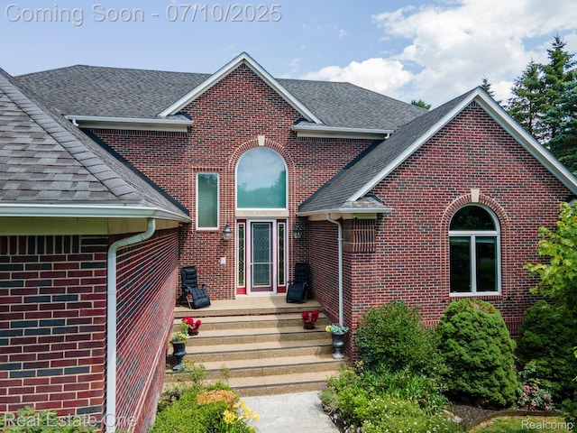 6120 Evanswood Rd, Troy, MI 48085 - traditional-style house featuring a shingled roof and brick siding