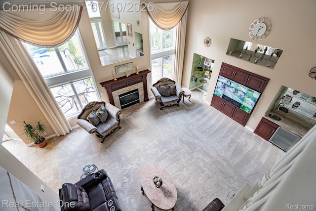 6120 Evanswood Rd, Troy, MI 48085 - carpeted living room with a towering ceiling and a tile fireplace
