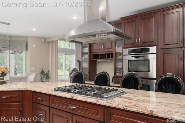 6120 Evanswood Rd, Troy, MI 48085 - kitchen with wall chimney range hood, stainless steel appliances, light stone counters, decorative light fixtures, and recessed lighting