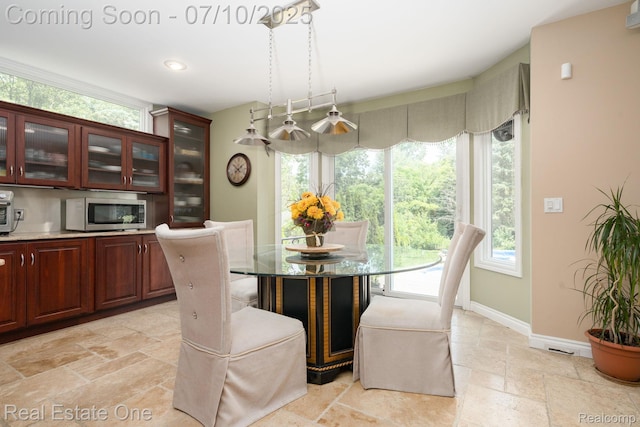 6120 Evanswood Rd, Troy, MI 48085 - dining room with stone tile flooring and healthy amount of natural light