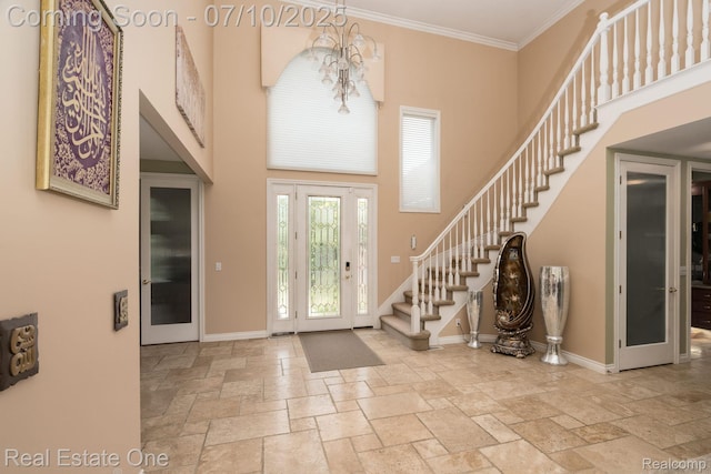 6120 Evanswood Rd, Troy, MI 48085 - entryway featuring stone tile flooring, a towering ceiling, stairway, and crown molding