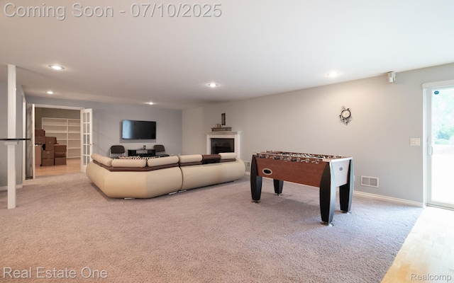 6120 Evanswood Rd, Troy, MI 48085 - recreation room featuring recessed lighting, carpet flooring, and a fireplace
