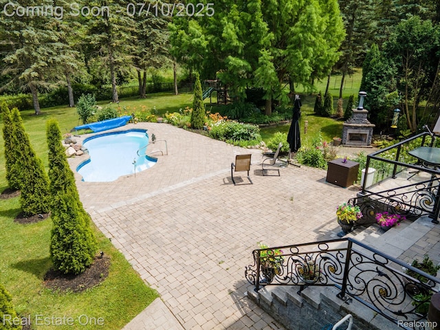 6120 Evanswood Rd, Troy, MI 48085 - view of pool featuring exterior fireplace, a patio, a yard, and a jacuzzi