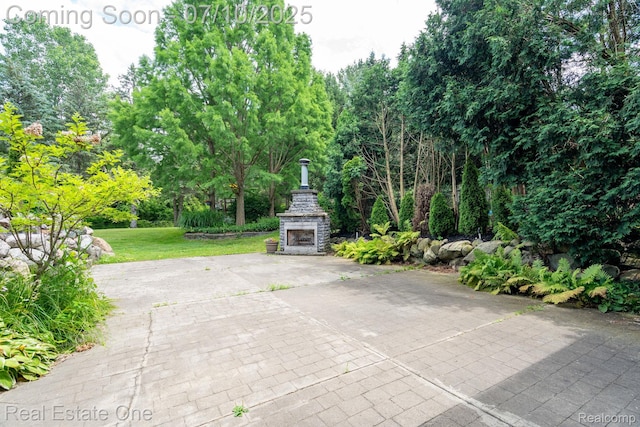 6120 Evanswood Rd, Troy, MI 48085 - view of patio with exterior fireplace