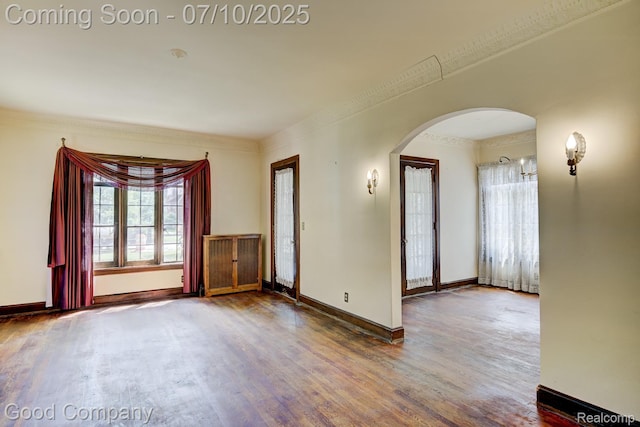 66 Oakdale Blvd, Pleasant Ridge, MI 48069 - empty room with arched walkways, wood finished floors, and crown molding