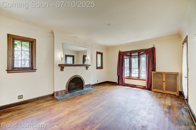 66 Oakdale Blvd, Pleasant Ridge, MI 48069 - unfurnished living room featuring wood finished floors, a fireplace with flush hearth, and crown molding
