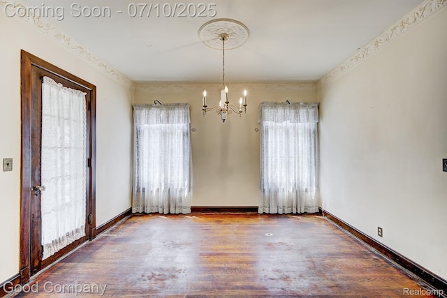 66 Oakdale Blvd, Pleasant Ridge, MI 48069 - unfurnished dining area with a chandelier, plenty of natural light, and wood finished floors