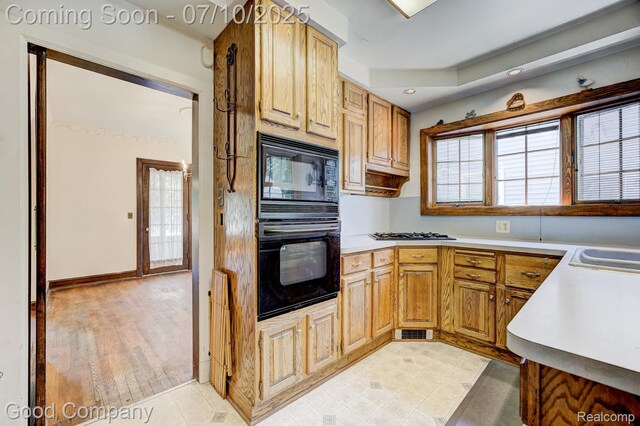 66 Oakdale Blvd, Pleasant Ridge, MI 48069 - kitchen with black appliances, light countertops, and recessed lighting