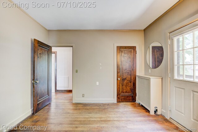 66 Oakdale Blvd, Pleasant Ridge, MI 48069 - entryway featuring light wood-style floors, radiator heating unit, and ornamental molding