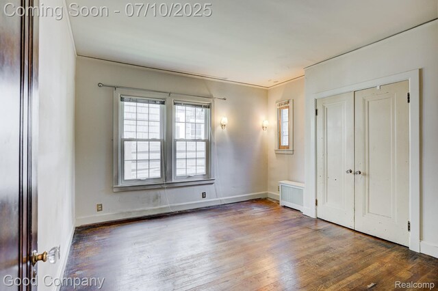 66 Oakdale Blvd, Pleasant Ridge, MI 48069 - unfurnished bedroom with wood finished floors, a closet, and ornamental molding