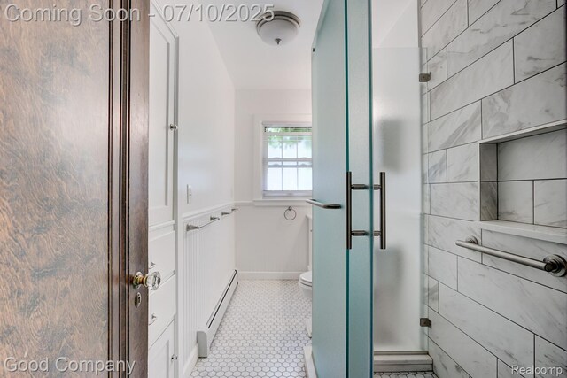 66 Oakdale Blvd, Pleasant Ridge, MI 48069 - bathroom with a baseboard heating unit, a stall shower, and tile patterned floors