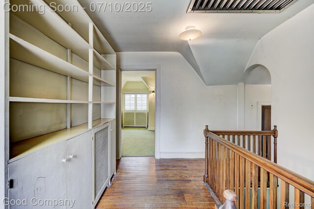 66 Oakdale Blvd, Pleasant Ridge, MI 48069 - hall with wood finished floors, lofted ceiling, an upstairs landing, and arched walkways