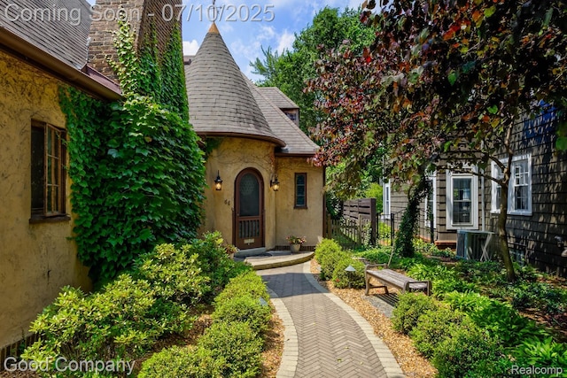 66 Oakdale Blvd, Pleasant Ridge, MI 48069 - entrance to property with a chimney, stucco siding, and a shingled roof