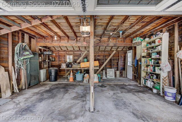 66 Oakdale Blvd, Pleasant Ridge, MI 48069 - garage featuring a garage door opener