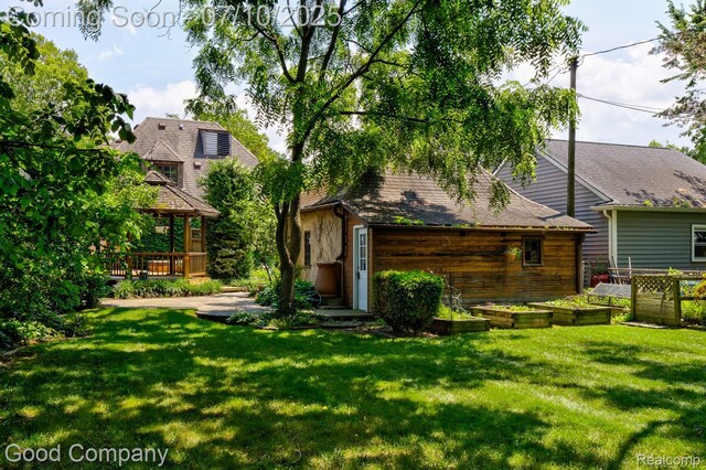 66 Oakdale Blvd, Pleasant Ridge, MI 48069 - rear view of house with a lawn, a gazebo, an outdoor structure, and a deck