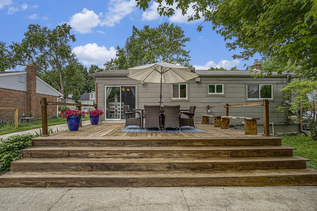 646 Dellwood Dr, Ann Arbor, MI 48103 - back of house with a wooden deck, outdoor dining area, and a chimney