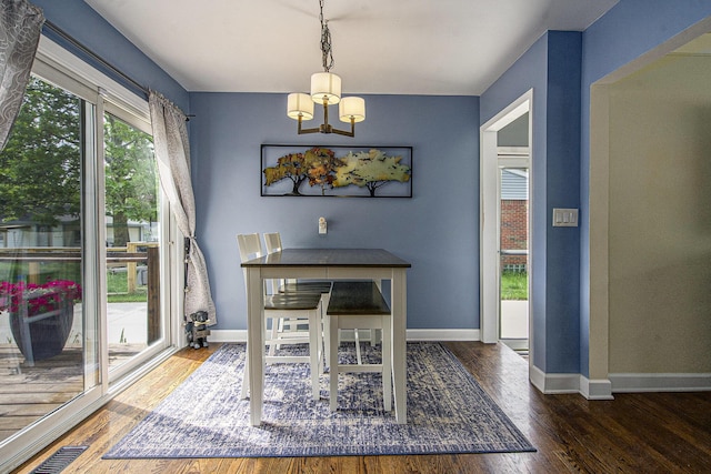 646 Dellwood Dr, Ann Arbor, MI 48103 - dining room with a chandelier and wood finished floors