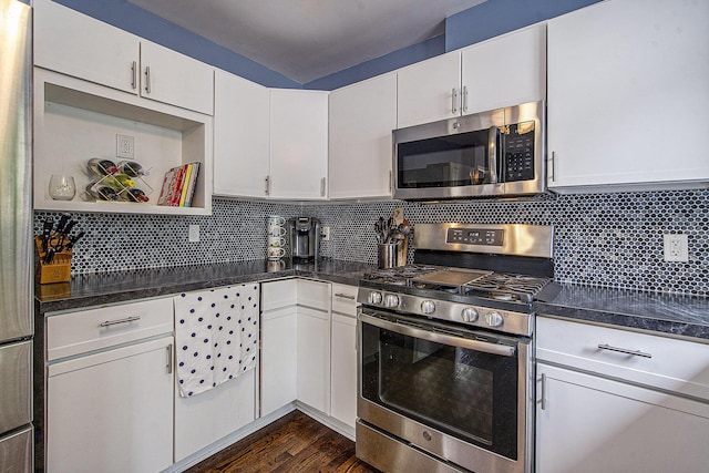 646 Dellwood Dr, Ann Arbor, MI 48103 - kitchen featuring stainless steel appliances, white cabinetry, dark wood-type flooring, and tasteful backsplash