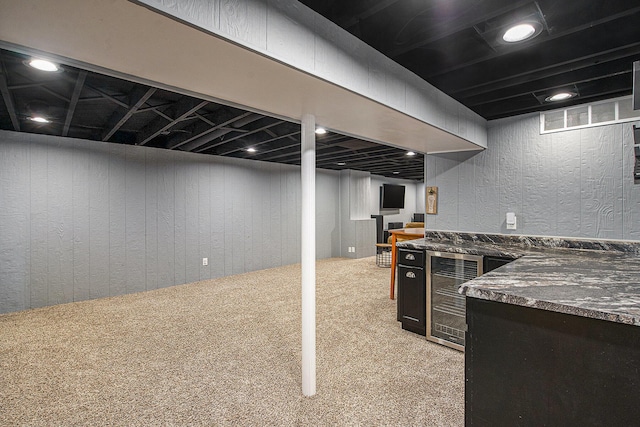 646 Dellwood Dr, Ann Arbor, MI 48103 - finished basement featuring wine cooler, light colored carpet, and a bar