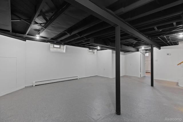 24371 Grove Ave, Eastpointe, MI 48021 - basement featuring a baseboard heating unit and baseboards