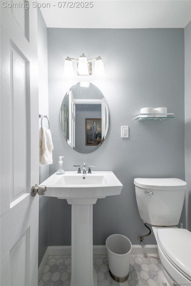11216 Old Bridge Rd, Grand Blanc, MI 48439 - bathroom with toilet and baseboards