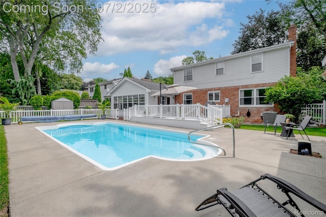11216 Old Bridge Rd, Grand Blanc, MI 48439 - view of pool with a patio area, a wooden deck, and a storage unit