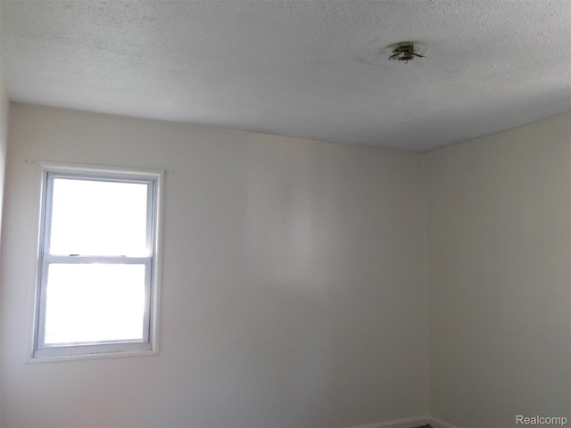 18949 Wall St, Melvindale, MI 48122 - unfurnished room with healthy amount of natural light and a textured ceiling