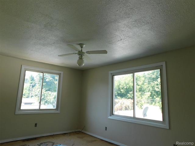 18949 Wall St, Melvindale, MI 48122 - spare room with plenty of natural light, a textured ceiling, and a ceiling fan