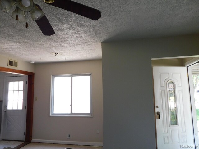 18949 Wall St, Melvindale, MI 48122 - entryway featuring a textured ceiling and a ceiling fan