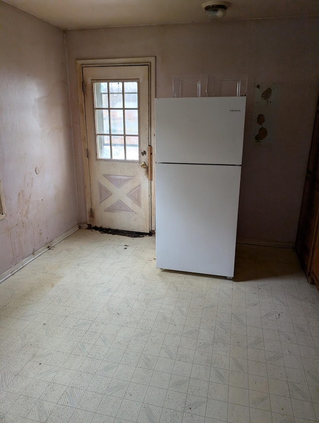 2606 Laredo St, Kalamazoo, MI 49004 - kitchen with freestanding refrigerator and light flooring