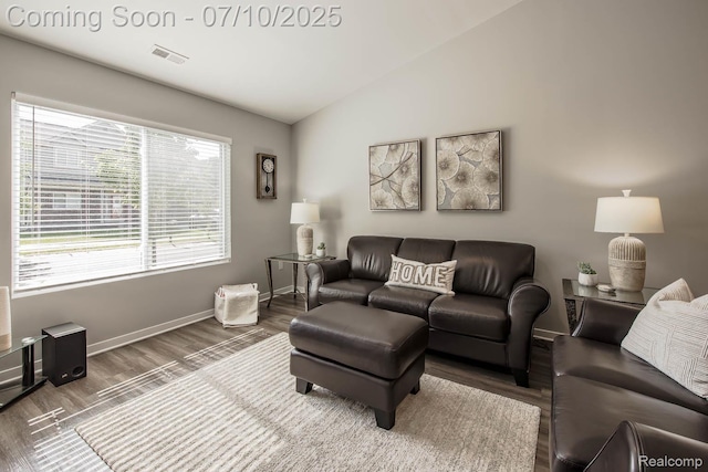 2489 Hatchery Crossing Dr, Waterford, MI 48329 - living area featuring vaulted ceiling and wood finished floors